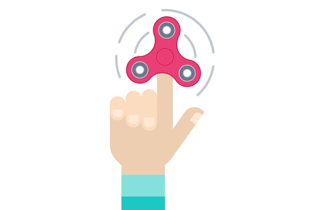 Symptoms of ADD and ADHD Symptoms of ADD and ADHD - hand holding a fidget spinner